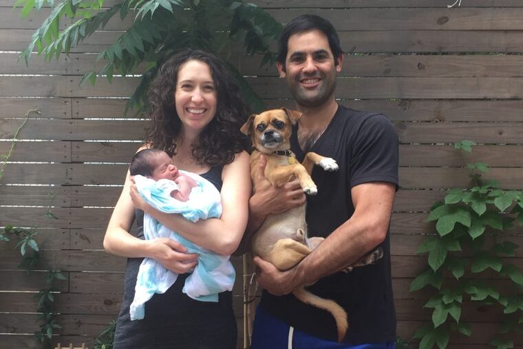 Darryn Lifson and Jessie Tettemer with their son, Eli, and their dog, Taco.