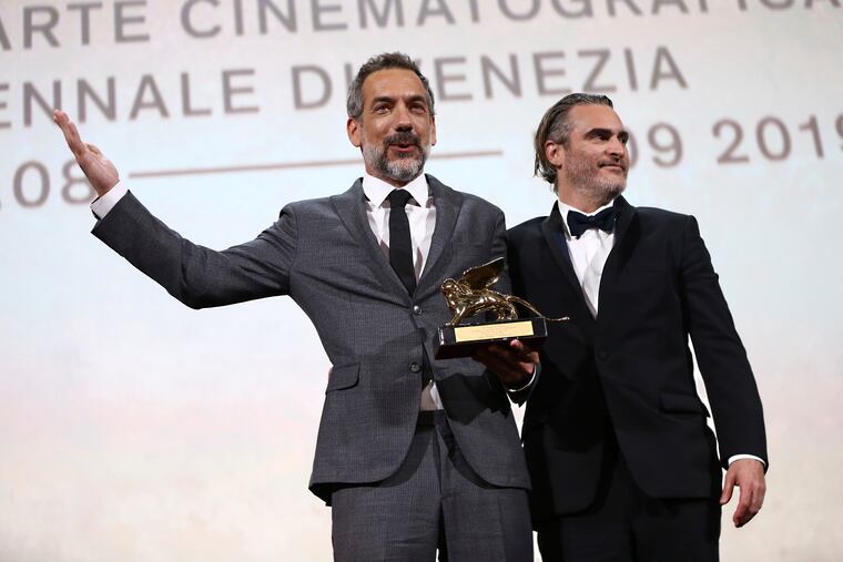 Director Todd Phillips, left, holds the Golden Lion for Best Film for 'Joker', joined by lead actor Joaquin Phoenix at the closing ceremony of the 76th edition of the Venice Film Festival, Venice, Italy, Saturday, Sept. 7, 2019.