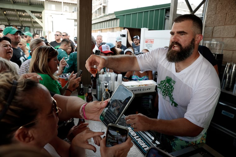 Jason Kelce takes his turn as a bartender during the 2023 fundraiser in Sea Isle to benefit the Eagles Autism Foundation.