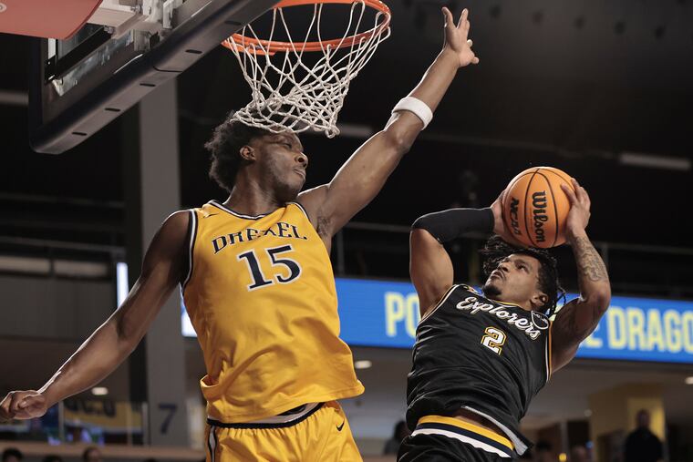 Drexel’s Cole Hargrove tries to block a shot by La Salle’s Corey McKeithan during their Big 5 matchup at the Daskalakis Athletic Center on Saturday.