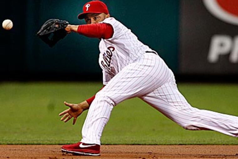 Placido Polanco said he aggravated his back injury diving for a ball. (Ron Cortes/Staff Photographer)