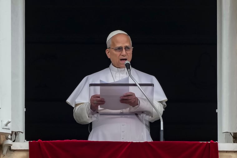 Pope Leo XIV appears at the window of his studio overlooking St. Peter's Square at the Vatican where Catholic faithful and pilgrims gathered for the traditional Sunday blessing March 15, 2026.