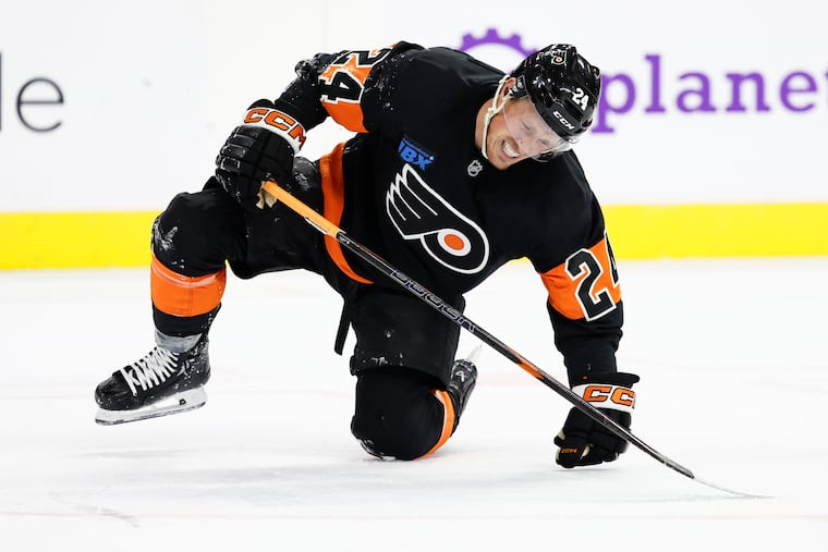 Flyers defenseman Nick Seeler reacts after getting hit by the puck against the St. Louis Blues on Thursday.