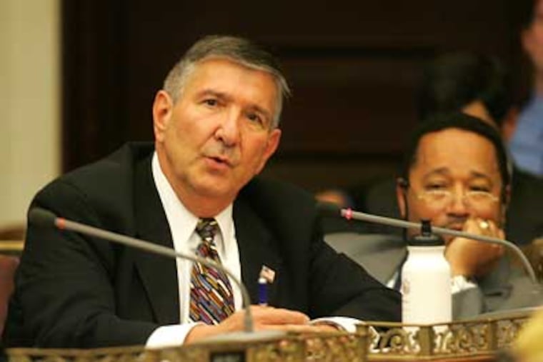 City Councilman Frank Rizzo questions City Finance Director Rob Dubow about proposed budget cuts in Council Chambers on Wednesday. (David Swanson / Staff Photographer)