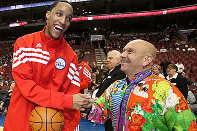 Sixers' fan Bryan Abrams greets Sixers' Evan Turner before a game. (Steven M. Falk/Staff Photographer)