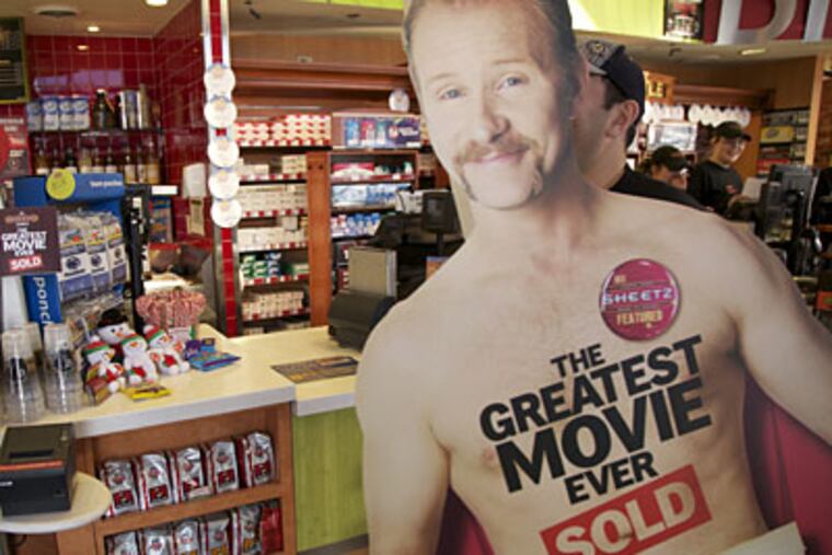 A cutout of director Morgan Spurlock in a Sheetz gas station. Sheetz,
based in Altoona, is one of the 20 sponsors of his documentary.