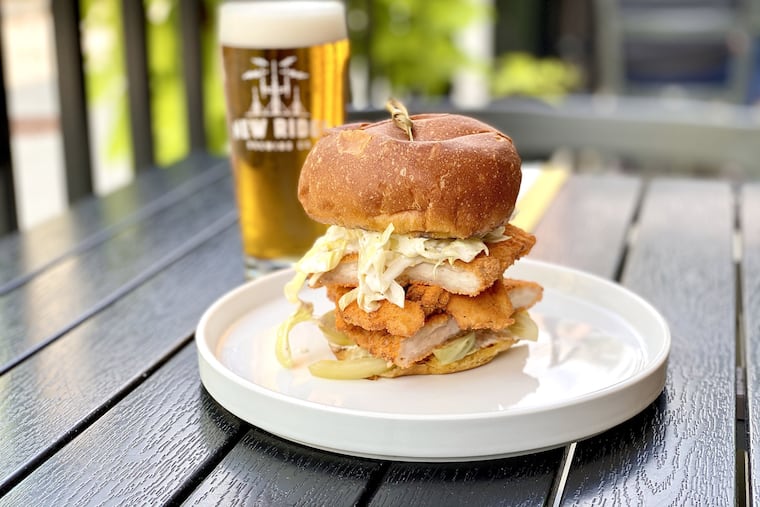 Chicken schnitzel sandwich with a beer at New Ridge Brewing Co. in Roxborough.