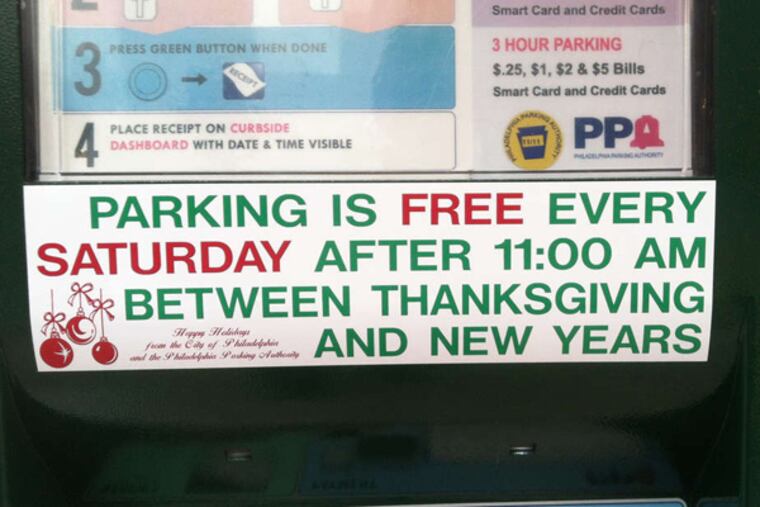 A notice on a parking kiosk near Eighth and Ludlow Streets reminds motorists that parking is free on Saturdays during the holiday season. ANDREW MAYKUTH / Staff