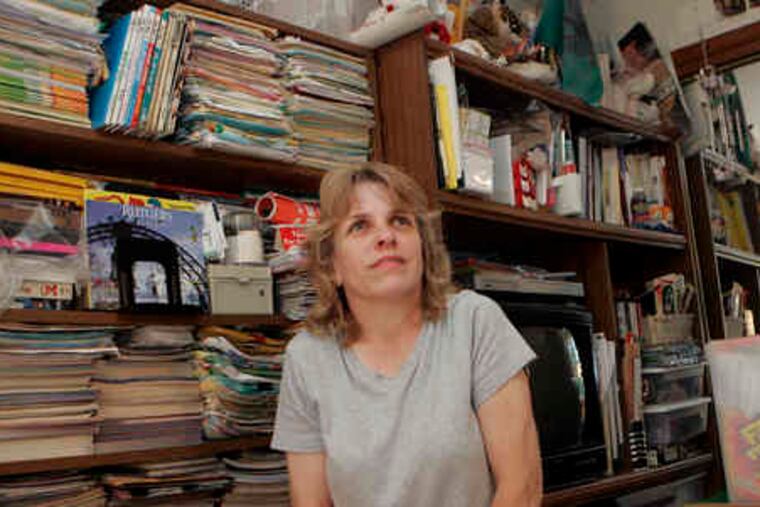 Clutterers Anonymous member Karen Johnson still lives surrounded by stuff in her Atco townhouse, but says the group is helping her make progress.