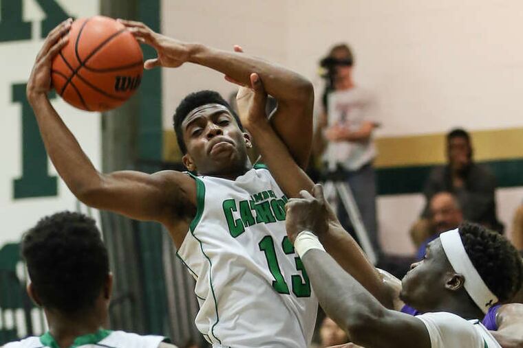 Camden Catholic's Courtney Cubbage looks for a teammate in a big win over rival Camden. on Feb. 2.