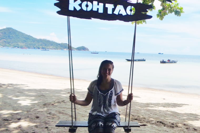Harri Leigh sits on a swing at Big Blue Diving in Koh Tao, Thailand, in May 2019.