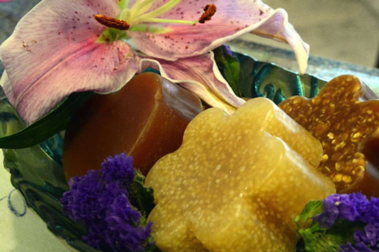 Finished breast milk soap made by Paula D'Amore of Greenacres, Fla., rests in a dish Aug. 29, 2014. The staty-at-home mom started Liquid Gold Soaps to make use of mothers' unused breast milk. The breast milk soap she makes from clients' own breast milk contains the milk, essential oils, organic honey, oatmeal as an exfoliant, and a coconut oil soap base. (Mark Randall/Sun Sentinel/MCT)