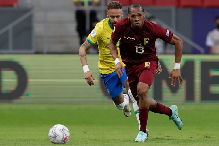 Union midfielder José Andrés Martínez on the ball in front of Brazil superstar Neymar during Venezuela's Copa América group-stage opener.