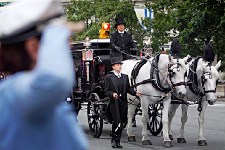 The casket carrying the body of Philadelphia Police Highway Patrol Officer Brian J. Lorenzo, who was killed in an accident on I-95 involving an alleged drunken driver, is taken to the Cathedral Basilica of SS. Peter and Paul. He was recalled as a dedicated family man and outstanding officer. ALEJANDRO A. ALVAREZ / Staff Photographer