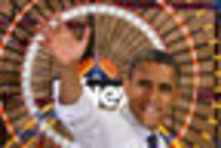 President Obama waves goodbye as he walks past a ferris wheel after speaking to workers and guests at the K'Nex factory in Hatfield, Pa. on 11/30/12. ( Michael S. Wirtz / Staff Photographer )