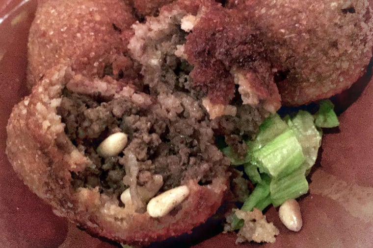 The kibbi fritters at Cedars contain spicy ground meat inside crispy bulgur wheat shells. ( Craig LaBan / Staff )