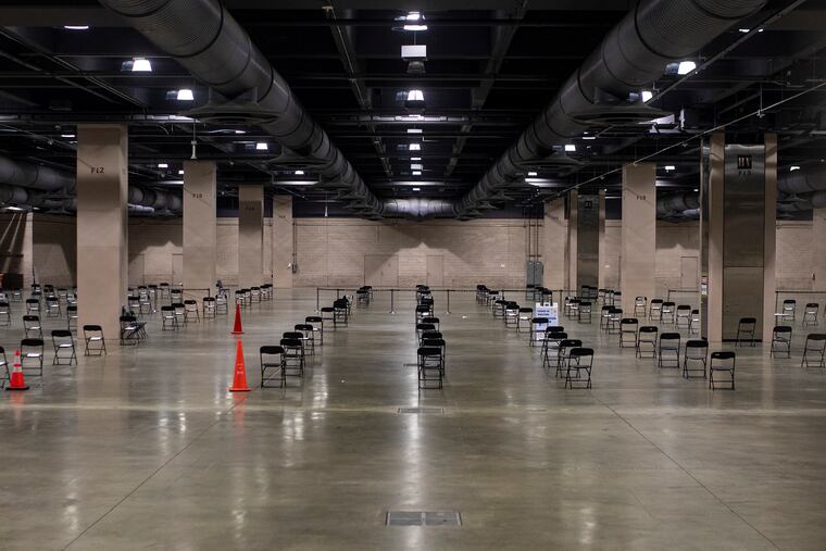 Chairs are still set up inside for the COVID Vaccine Clinic at the Pennsylvania Convention Center on Tuesday, Jan. 26, 2021. The city has ended its partnership with the Philly Fighting COVID organization.