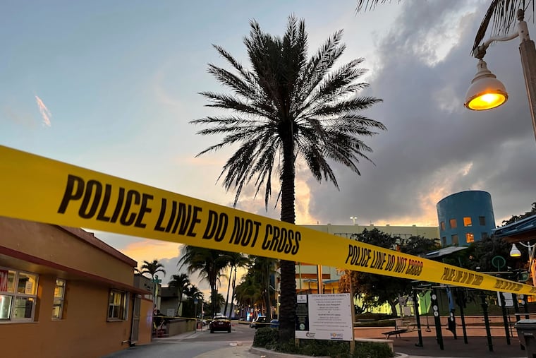 Police cordon off an area as they respond to a shooting near the Hollywood Beach Broadwalk in Hollywood, Fla., on Monday.