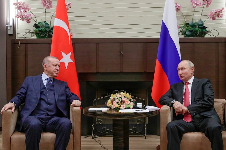 FILE - Russian President Vladimir Putin, right, and Turkish President Recep Tayyip Erdogan talk to each other during their meeting in the Bocharov Ruchei residence in the Black Sea resort of Sochi, Russia, on Sept. 29, 2021. Putin's visit to Iran starting Tuesday is intended to deepen ties with regional heavyweights as part of Moscow's challenge to the United States and Europe amid its grinding campaign in Ukraine.
