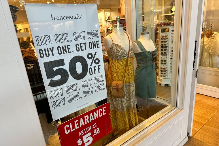 A sign trumpets discounts available at a clothing store in Lone Tree, Colo.