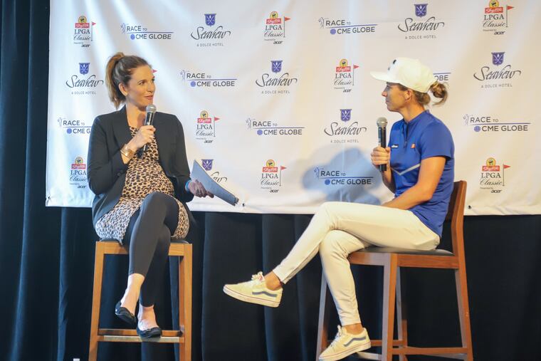 Cara Banks talks to LPGA player Mel Reid at the ShopRite LPGA Classic media day in August. Reid won the event last year.