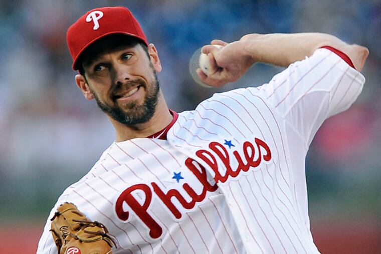 Cliff Lee throws a pitch in the first inning of a baseball game against the Cincinnati Reds on Friday, May 17, 2013, in Philadelphia. (Michael Perez/AP)