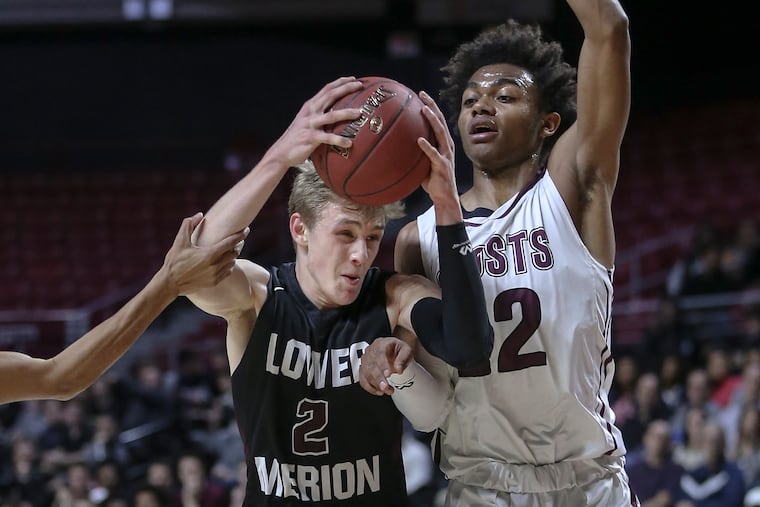 Lower Merion's Jack Forrest drives on Abington's Xavier Monroe during 2nd quarter of District 1 Class 6A boys' basketball semifinals at the Liacouras Center, Tuesday, February 27, 2017.