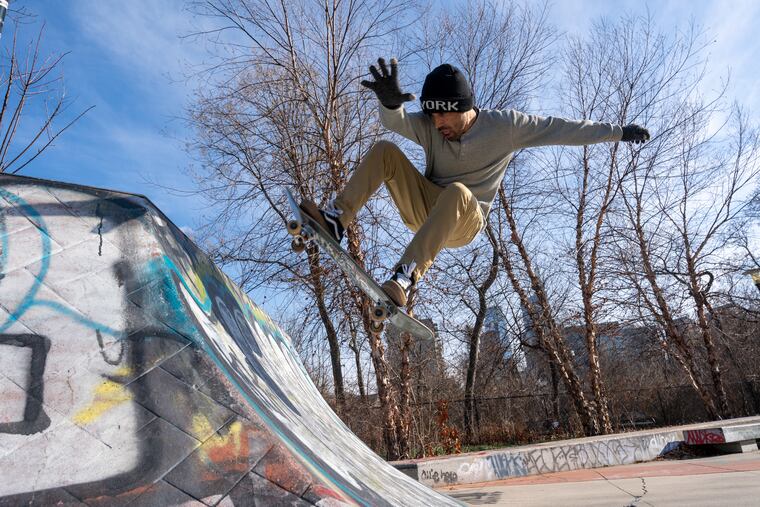 Merza Mohammadi, who was evacuated from Afghanistan amid the Taliban takeover in August, flashes across a quarter pipe at Paine’s Park in Philadelphia, Pa., on January 14, 2022.