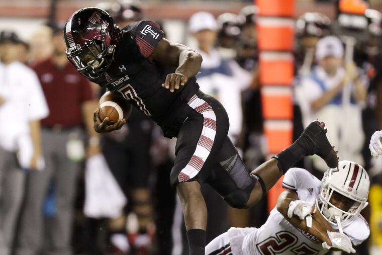 Temple running back Ryquell Armstead leaps over UMass safety Jesse Monteiro during the third-quarter on Friday, September 15, 2017 in Philadelphia. YONG KIM / Staff Photographer