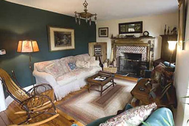 Rachel Malinowitzer says she was enraptured by the nearby covered bridge and the land, “and Nancy fell in love with the house.” This is the living room. (Ed Hille / Staff Photographer)