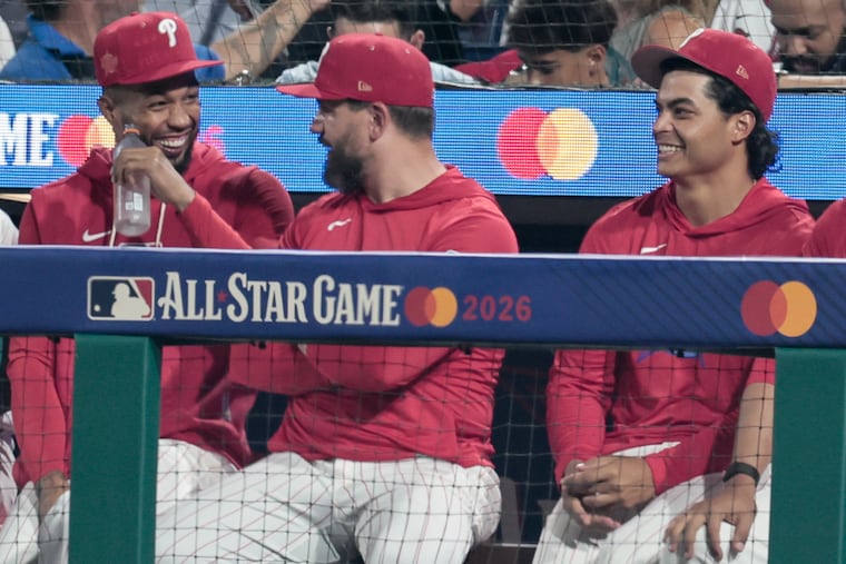 Cristopher Sánchez, Kyle Schwarber, and Jesús Luzardo share a laugh during the All-Star Game on Tuesday at Citizens Bank Park.