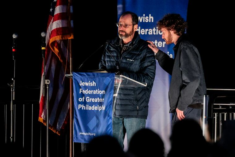 Amichai Shdaimah (left) of Ardmore speaks during a rally sponsored by the Jewish Federation of Greater Philadelphia. His 84-year-old stepmother, Ditza Heiman, is among the missing and is presumed to be a hostage. He spoke Monday to supporters at the Philly Stands With Israel Rally at the Saligman campus in Wynnewood.