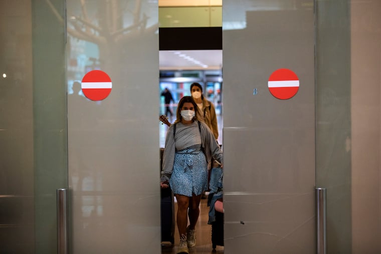 Passengers arriving at the ariport airport in Barcelona, Spain in mid-May.