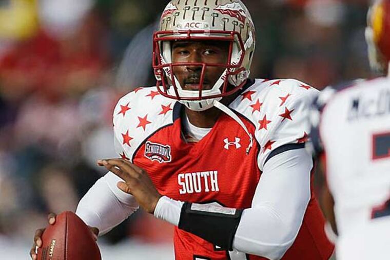 Senior Bowl South Squad quarterback EJ Manuel of Florida State (3)
looks for a receiver as North Squad defensive back TJ McDonald of
USC (7) guards South Squad tight end Mychal Rivera of Tennessee (81) in the first half of the Senior Bowl college football game at Ladd-Peebles Stadium in Mobile, Ala., Saturday, Jan. 26, 2013. (Dave Martin/AP)
