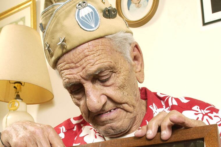 Nicknamed "Wild" Bill, Bill is a veteran paratrooper and great character. He lost his right leg in shelling of Bastone,Belgium during the Battle of the Bulge, but it hasn't slowed him down. Here he is at home with just a few of his medals ,ribbons, lanyards and citations,including a silver star and various honors from the French,Dutch and Belgiums,wearing a cap festooned with two General's stars. They were given him by fellow "Band of Brothers."