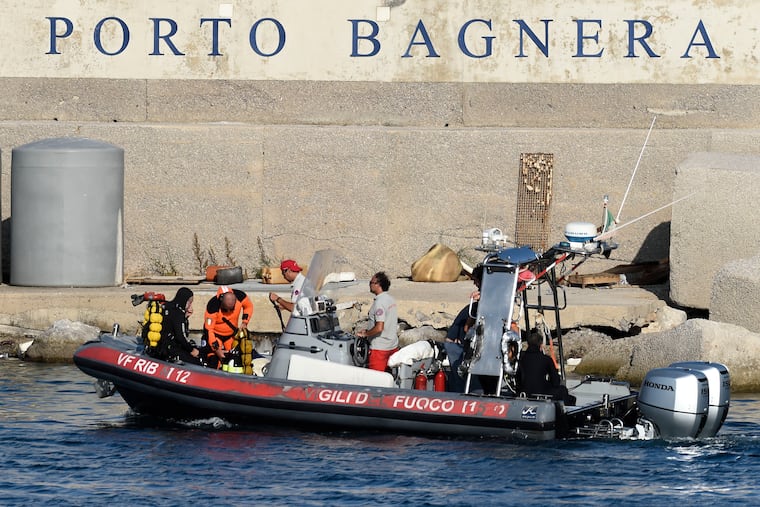 Scuba divers arrive at the harbor of Porticello, southern Italy, on Tuesday, Aug. 20, 2024.