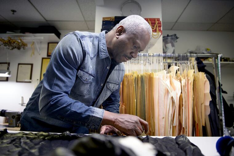 Ron Wilch works his magic at the Wardrobe Clinic in Center City, a one-man shop that specializes in
alterations for clients who purchase clothing online.