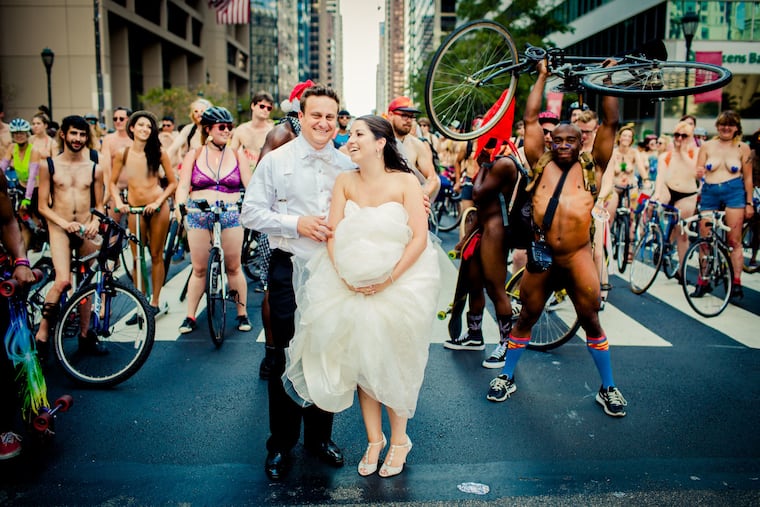 Ross and Blair Cohen snap photos with the Naked Bike Ride in 2015 on their wedding day.