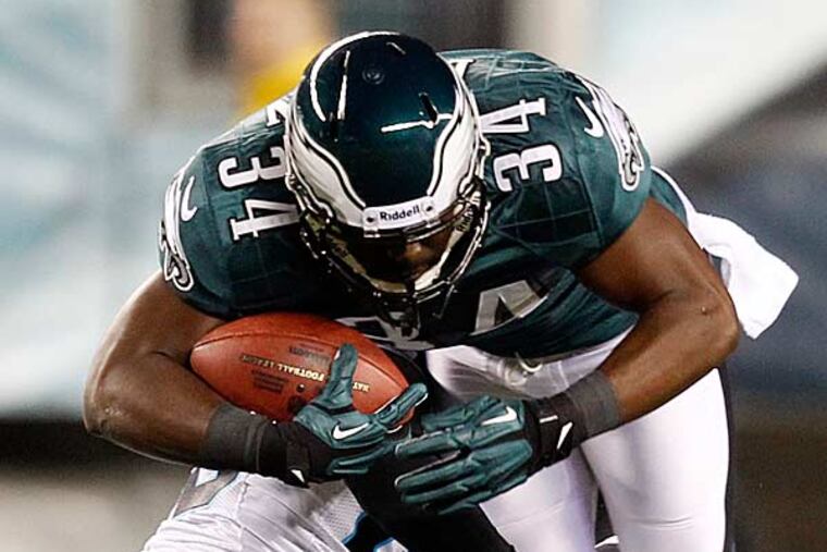 Bryce Brown (right) is tackled by Carolina Panthers free safety Sherrod Martin in the first half of an NFL football game, Monday, Nov. 26, 2012, in Philadelphia. (Mel Evans/AP)