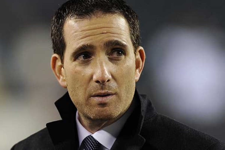 Philadelphia Eagles general manager Howie Roseman watches warm ups before an NFL football game against the Cincinnati Bengals, Thursday, Dec. 13, 2012, in Philadelphia. (AP Photo/Michael Perez)