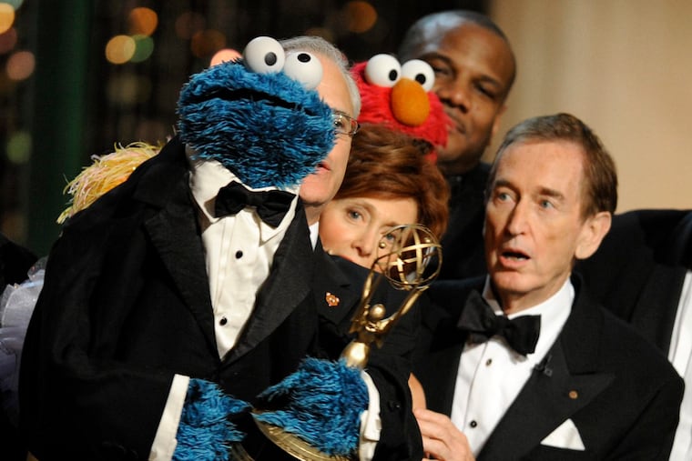 Bob McGrath, right, looks at the Cookie Monster as they accept the Lifetime Achievement Award for '"Sesame Street" at the Daytime Emmy Awards in 2009 in Los Angeles. McGrath, widely known for his portrayal of one of the first regular characters on “Sesame Street,” has donated his collection of musical scores and instrumental parts to the Free Library of Philadelphia.