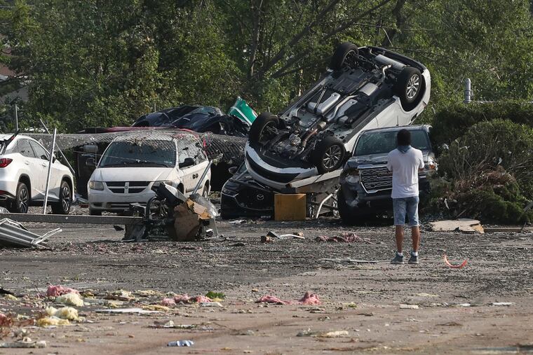 Cars are seen flipped over at the Faulkner Buick GMC Trevose after a tornado ripped through Bucks County on Thursday evening on Friday, July 30, 2021.