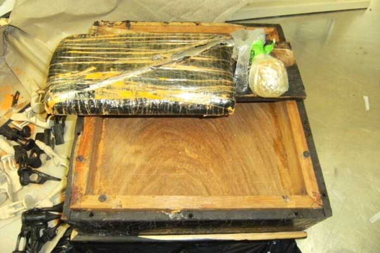 Customs officers discovered two pounds of hash inside a chessboard