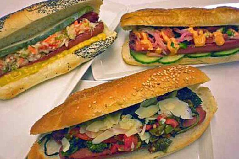 Contenders for top dog are (clockwise from left) the Olde Philadelphia, the Citizens Bank Park Summer Hot Dog, and the South Philly. (Dan Smith / Aramark)