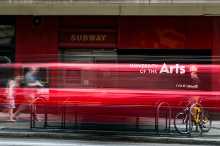 Pedestrians walk past the University of the Arts on South Broad Street last week.