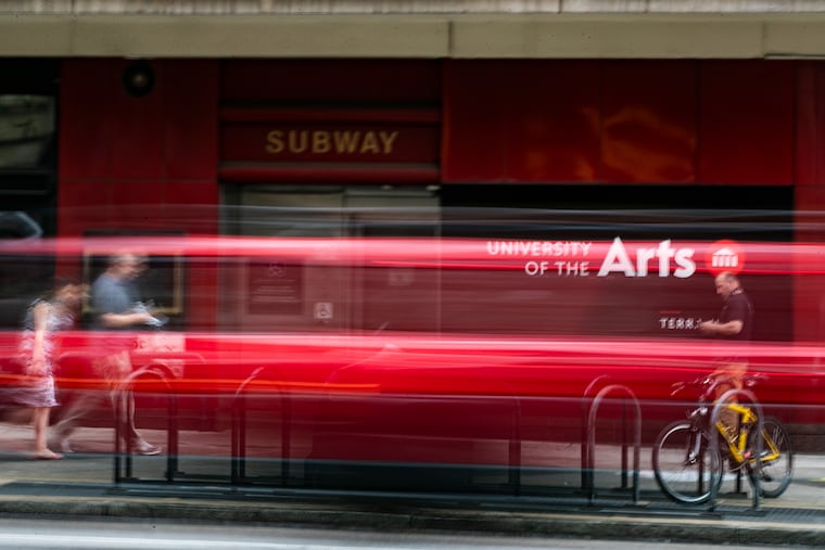Pedestrians walk past the University of the Arts on South Broad Street in Philadelphia, June 3, 2021.
