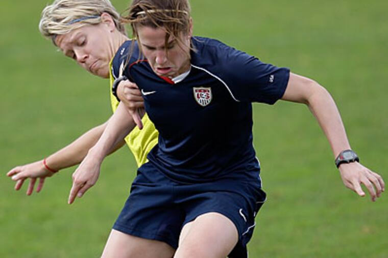 Lori Lindsey (front) helped the U.S. win the Algarve Cup tournament in Portugal. (Armando Franca/AP)