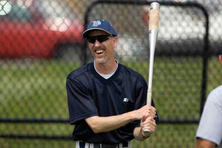 North Penn head coach Bob McCreary shares a laugh with one of his assistants as he takes his team through warm-up drills. The team leaves today for the trek to Altoona.