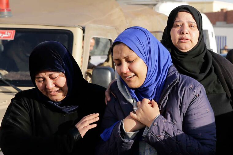 Family members mourn security personnel killed in Sinai on Thursday after receiving their bodies in Cairo.