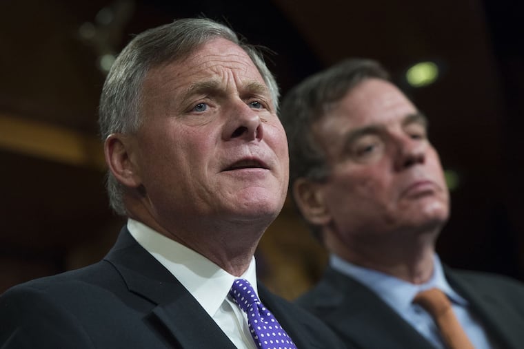 Senate Intelligence Committee Chairman Richard Burr (left, R-N.C.) and Vice Chair Mark Warner (D-Va.).